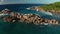 Aerial dolly and lift up over shore and gulf Grand l`Anse, La Digue