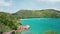 Aerial dolly over coast Anse Lazio beach close up to huge boulder