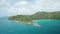 Aerial dolly over Indian ocean toward to coast cape Anse Lazio beach