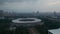 Aerial dolly shot of Gelora Bung Karno athletic stadium facilities in urban city center of Jakarta