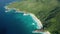 Aerial dolly tilt up over southern part La Digue in Grand Anse beach