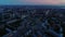 Aerial of Downtown in evening, cityscape on sunset. Aerial view of traffic at the intersection of a circle. The drone