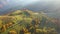 Aerial drone 4k view of autumn countryside landscape with wooden houses in Transylvania, Rom