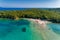 Aerial drone bird`s eye view of Bella Vraka Beach with turquoise sea in complex islands in Sivota area, Ionian sea, Epirus, Greec