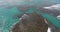 Aerial drone bird`s eye view video on sea waves and rocks, turquoise water. tropical paradise pacific atoll islands. Top