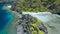 Aerial drone circle movement over hidden lagoon of star beach on Tapiutan island near Matinloc shrine. El Nido, Palawan
