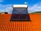 Aerial drone close up of a  solar water heater boiler on rooftop