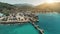 Aerial drone flight above ocean harbor