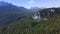 Aerial drone flight of an asphalt road in the Dolomites mountains in Italy