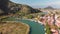 Aerial drone fly in Dalyan. River, town, summer day