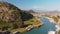 Aerial drone fly in Dalyan. River, town, summer day