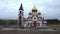 aerial and drone flyby of the new Russian Orthodox church on the bank of the Siberian river Yenisei, Krasnoyarsk. Holy