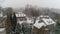 Aerial Drone flying above houses in Villanova, PA suburban Philadelphia area in heavy snow