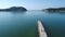 Aerial drone flying, breakwater of stone in the sea