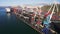 Aerial drone footage of a cargo terminal with cargo ships