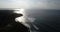 Aerial drone footage of ocean waves breaking on shore