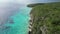 Aerial drone footage over Grote Knip in West Punt Curaca. Carribean beach drop down footage over the clear sea and sand