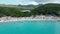Aerial drone footage over Playa Porto Marie in West Punt Curaca. Carribean beach drop down footage over the clear sea