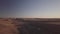 aerial drone footage over prairie pasture land at sundown in rural North Dakota