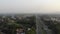 Aerial drone footage sunrise at toll highway road with hazy mountain view at Bogor, Indonesia