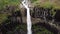 Aerial drone footage of Svartifoss waterfall near Vatnajokull in Iceland.