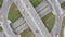 Aerial drone footage of transport junction. Day view from above of traffic crossroad junction with circle road and