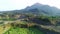 Aerial drone glides over an abandoned mine, capturing the eerie beauty of nature reclaiming manmade structures in Ranu