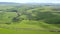 Aerial drone, green grass and road in countryside of natural scenery, greenery and big open fields. View of street