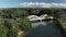 Aerial drone motion towards twin arched bridge over the river Anahulu in Haleiwa on Oahu