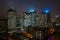 Aerial drone night shot of Skyscrapers with lights on in La Defense, financial district of Paris