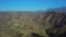 Aerial drone over countryside and long winding road whit blue sky, California, USA