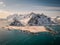Aerial drone panorama view over flakstad. Beautiful mountains in winter wonderland north of norway. Peaceful and ambient aerial vi