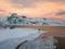 Aerial drone panoramic view. Beautiful sunset over the mountains and sea of the Lofoten Islands. Reine, Norway. Winter landscape w