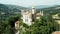 Aerial drone panoramic view of the Rocchetta Mattei castle in Italy on sunny summer day, view from above. High quality