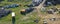 Aerial drone perspective view on car junkyard with old destroyed cars and old rusted parts waiting for recycling