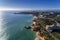 Aerial drone photo of the beautiful coastline and beaches with the Ponta Joao de Arens on the bacground