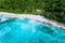 Aerial drone photo of great tropical dream beach Anse Bazarca, Mahe island, Seychelles. White powdery sand, azure water