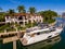 Aerial drone photo of a luxury waterfront mansion home on Allison Island Miami Beach Florida