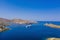 Aerial drone photo of a luxury yacht anchored offshore. Calm sea, blue sky background