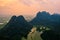 Aerial drone photo - Mountains and lakes of northern Vietnam at sunset.