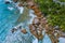 Aerial drone photo of stony part of beautiful anse cocos beach at La Digue, Seychelles