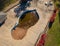 Aerial drone photo of an uncovered swimming pool filled with fallen autumn leaves