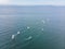 Aerial drone photo of young teenagers on small sailing boats competing in the regatta at mediterranean emerald sea