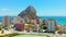 Aerial drone point of view real time of Calpe cityscape, Penyal d`Ifac