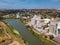 Aerial drone pov view of industrial cityscape with factory build