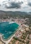 Aerial drone shot Adriatic sea town ferry port on Vis Island in Croatia summer