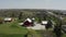 Aerial drone shot of american countryside landscape. Farm, red barn, Rural scenery, USA,