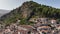 Aerial Drone Shot of Berat city in Albania in a day. Historical oriental houses in the old city of Berat in Summer