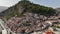 Aerial Drone Shot of Berat city in Albania in a day. Historical oriental houses in the old city of Berat in Summer