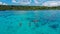 Aerial Drone Shot of Boat with Snorkelers out on the coral reef in Menjangan island, Bali, Indonesia